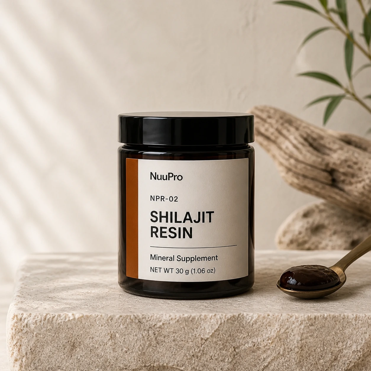 NuuPro Shilajit Resin jar with a spoonful of dark resin.